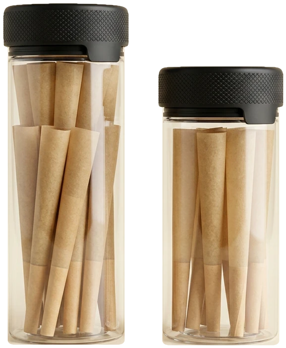 The two SWITCH jars side by side &mdash; tall 24-pack and short 12-pack, clear glass with black child-resistant lids, packed with kraft cones